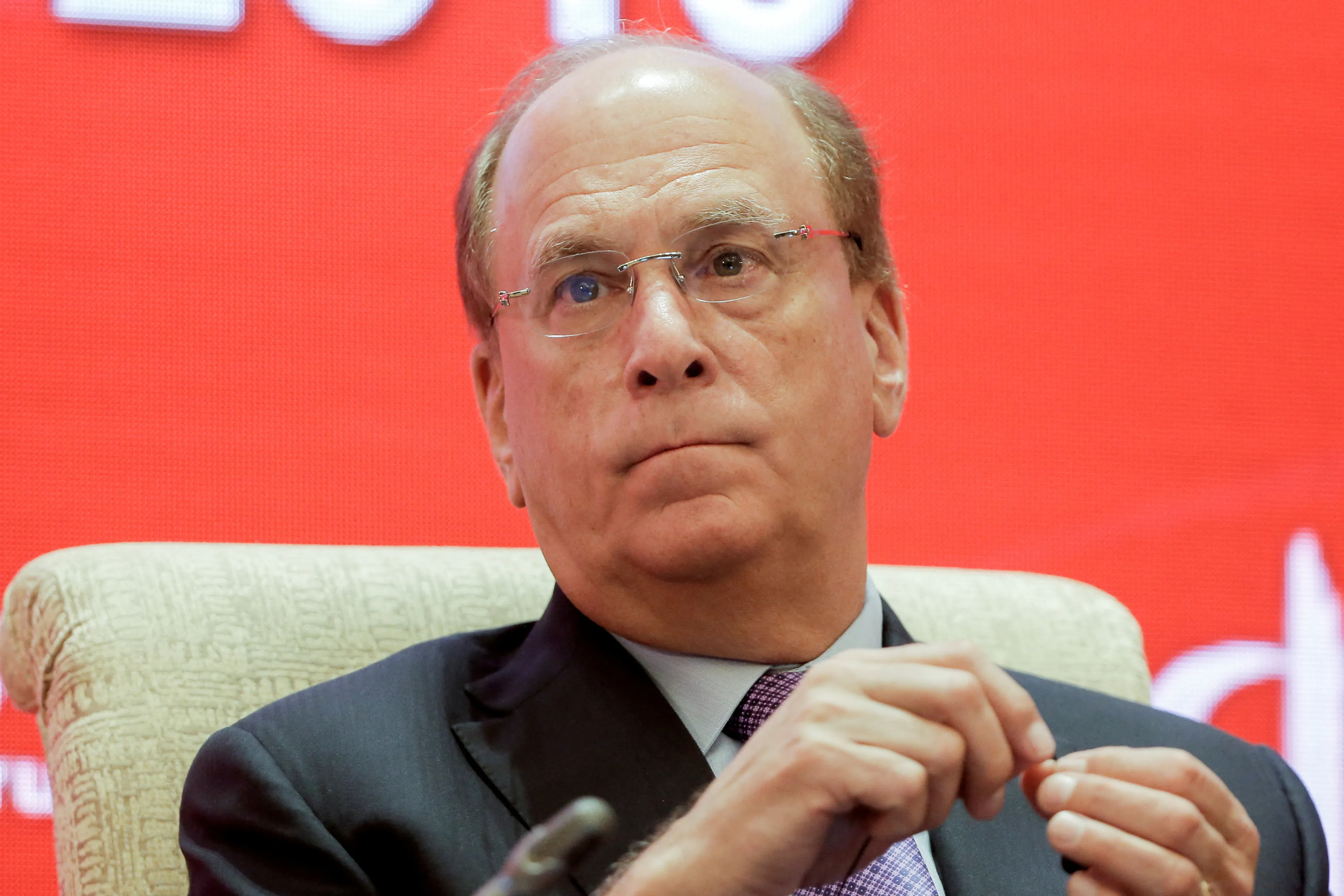 BlackRock CEO Fink warns of financial risks, persistent inflation | Reuters