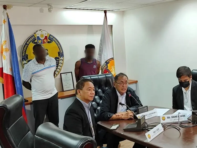 Two-suspected-scammers-presented-by-the-National-Bureau-of-Investigation-following-their-arrest-under-the-Revised-Penal-Code-and-the-Cybercrime-Prevention-Act.-The-suspects-allegedly-deceive-victims-into-purchasi.jpg