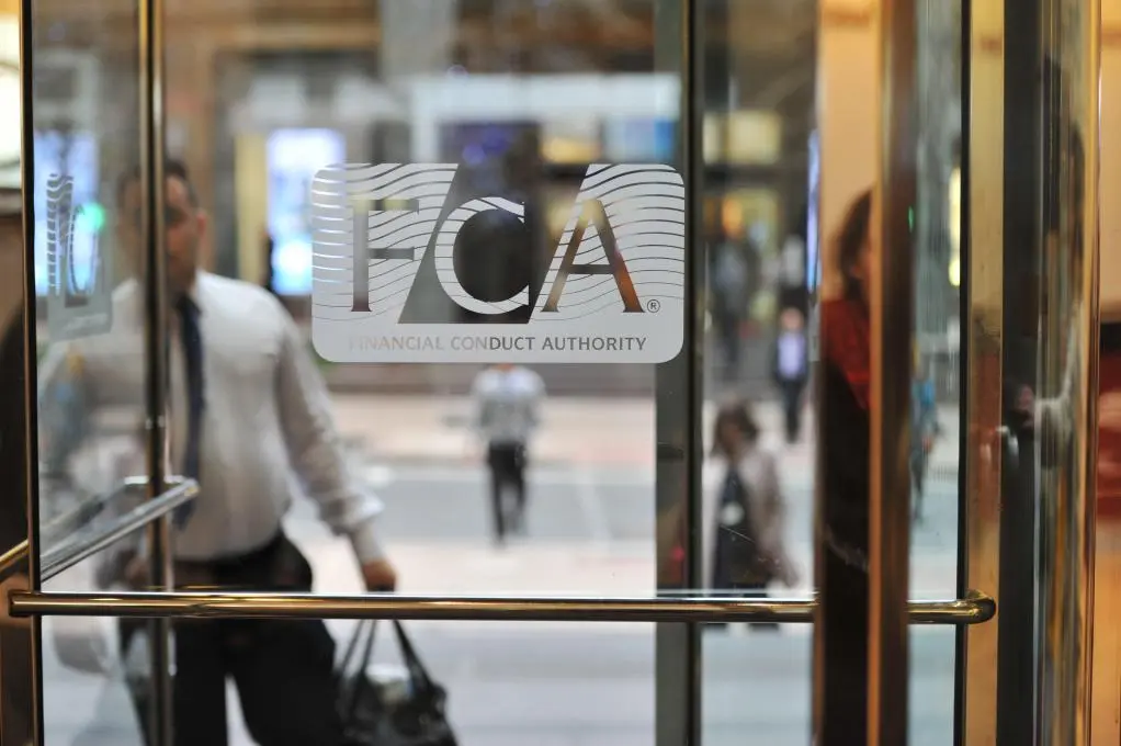 FCA logo on a glass door in Canary Wharf, London.