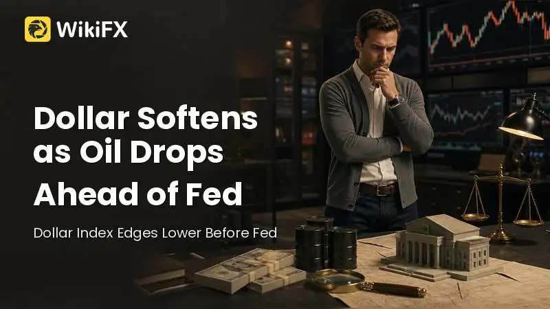 Dollar Softens as Oil Drops Ahead of Fed