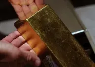 Ouro sobe com alta do dólar e rendimentos dos Treasuries